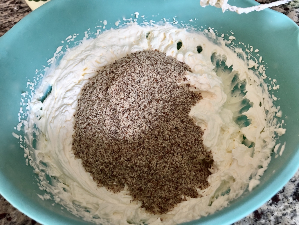 adding the nuts to the cream
