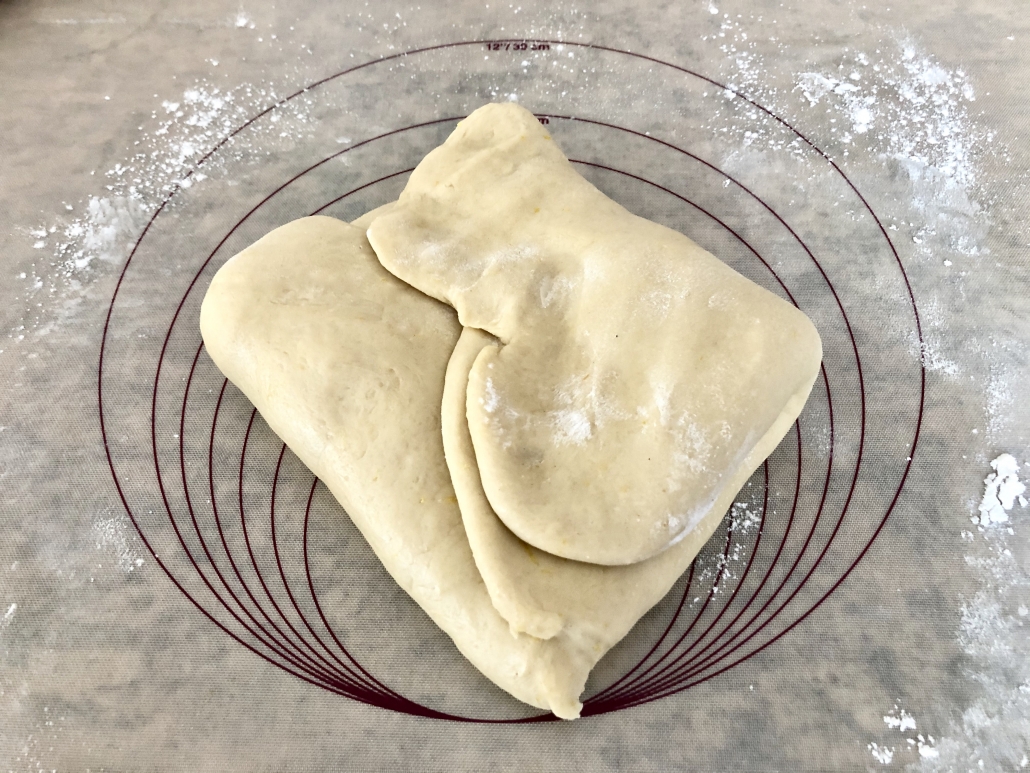 Adding the raisins to the dough and fold